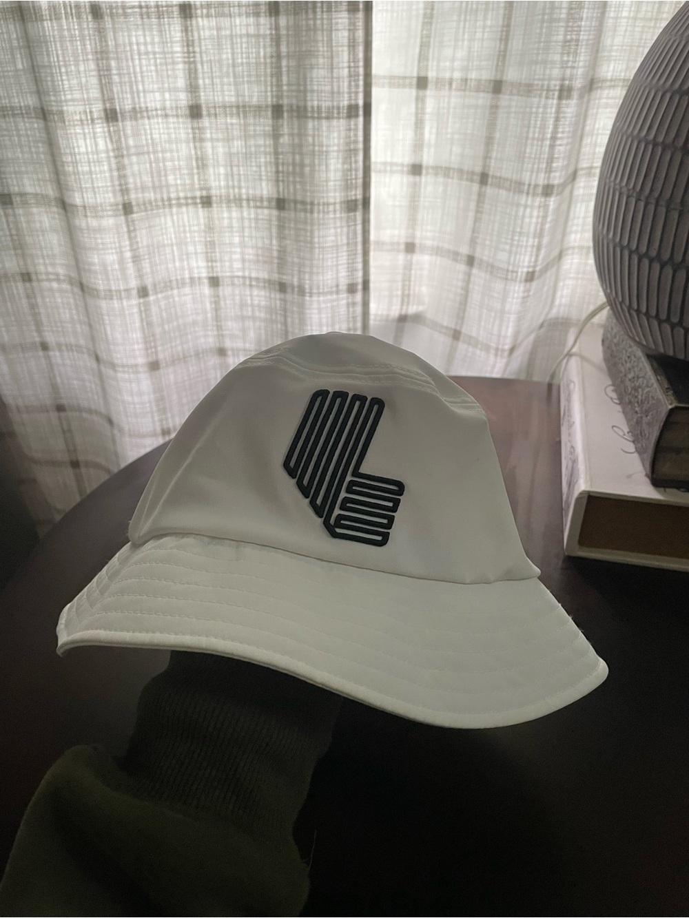 White Bucket Hat with Black LIV golf Logo